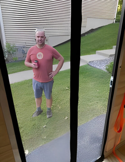 Man inspecting new toy hauler side door screen