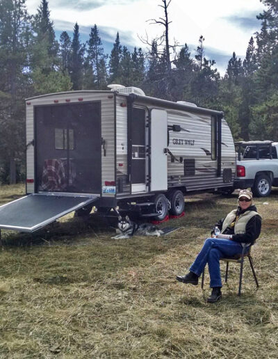 Man with dog guarding his RV toy hauler